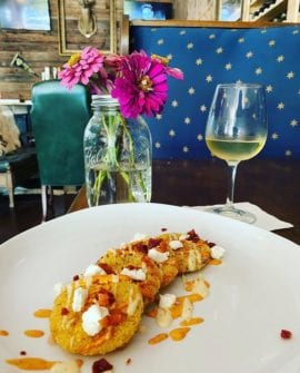 Fried green tomatoes on a pretty plate