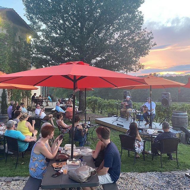 People sitting at tables at Ozan Winery