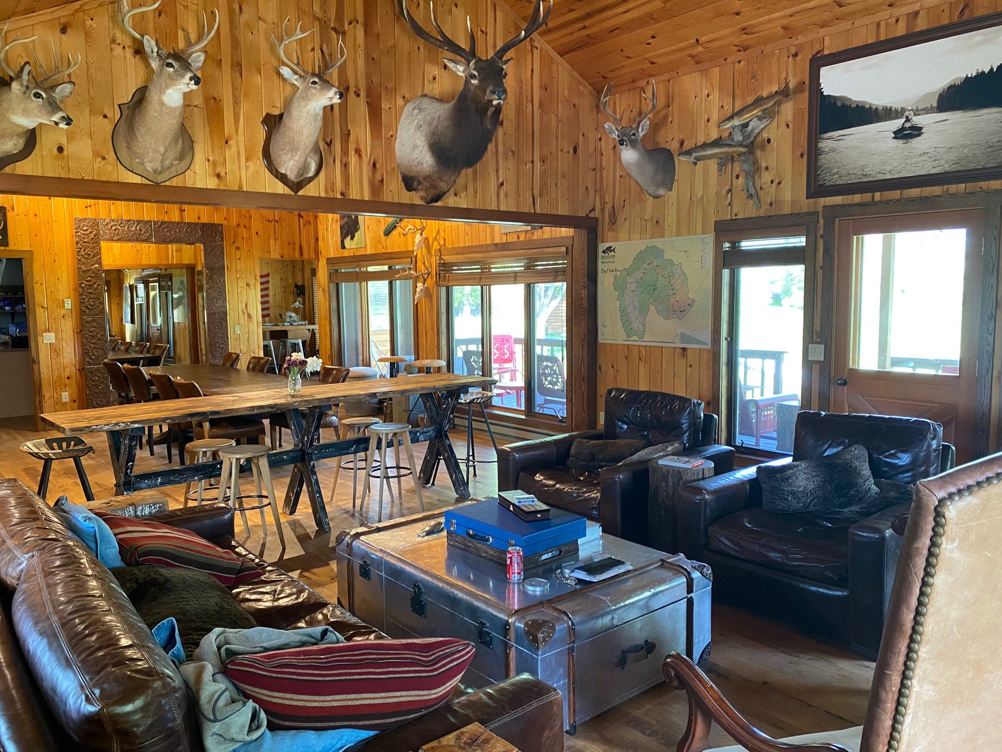 Dining room and deer heads on wall at Ruby Drake Lodge