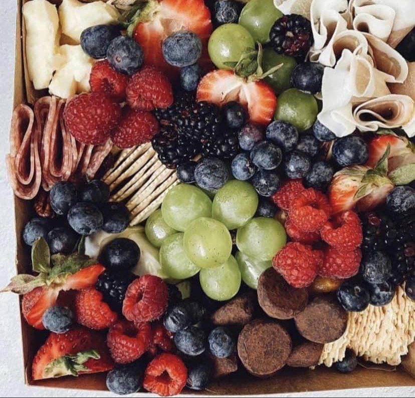 87th Masters Tournament Hors D'oeuvre box of fruit, cheese, crackers, salami, and chocolate